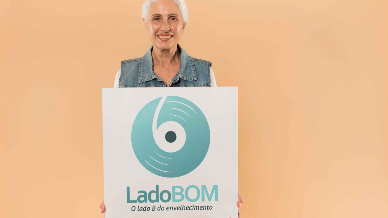 a woman holding a sign that says ladboom make by af studio