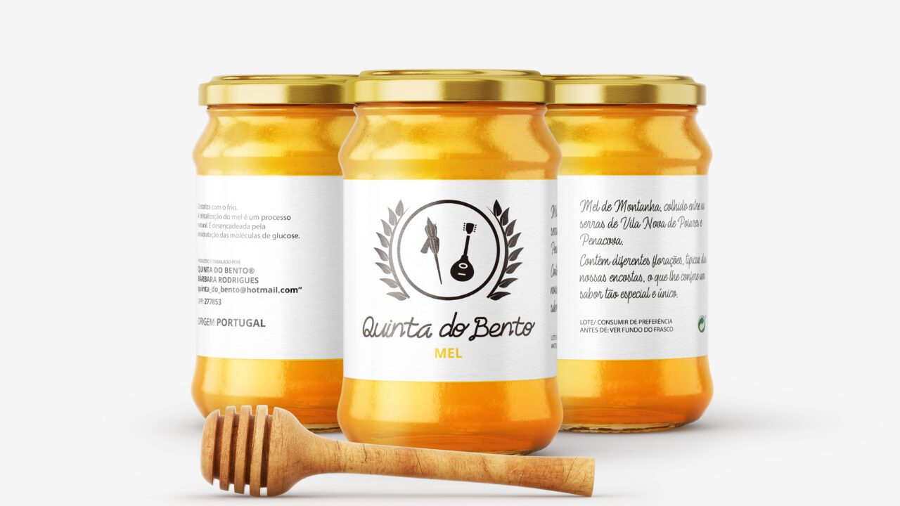 three jars of honey with a wooden spoon af studio