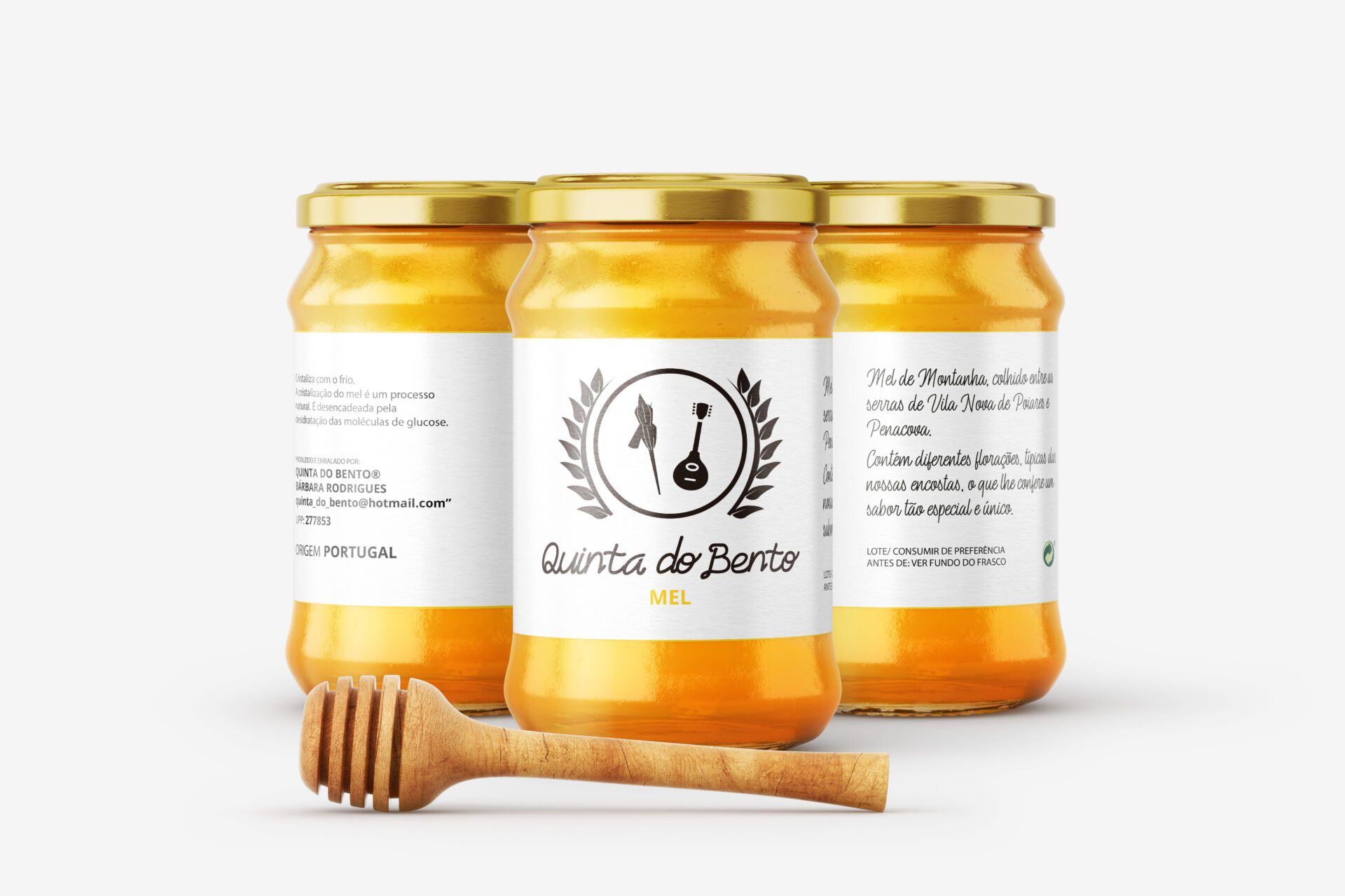three jars of honey with a wooden spoon af studio